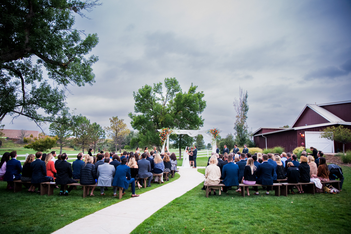 A wedding ceremony at The Barn at Raccoon Creek in Denver, Colorado.
